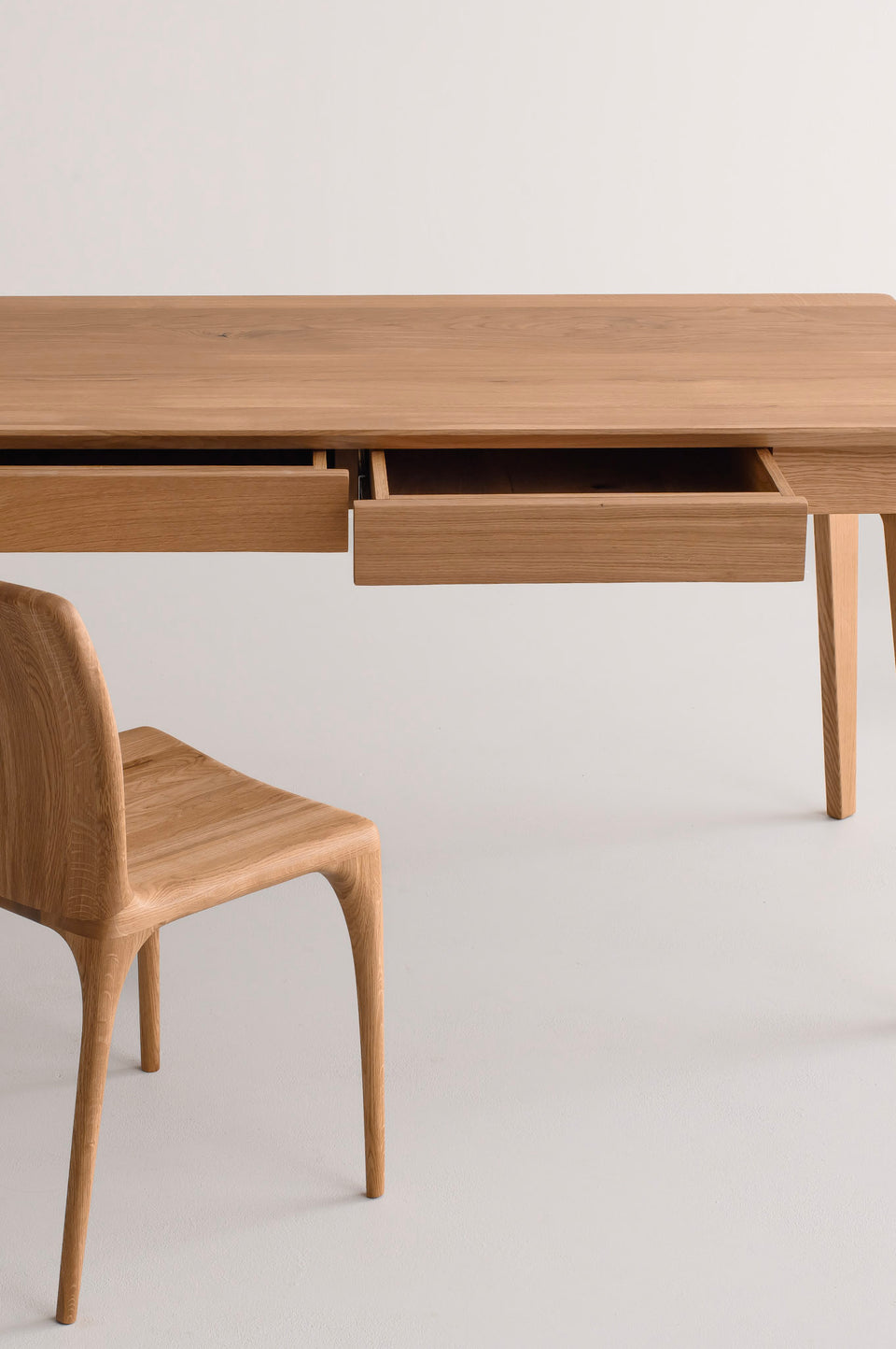 One drawer in the 120 cm version, two drawers in the 140 cm and 160 cm versions.