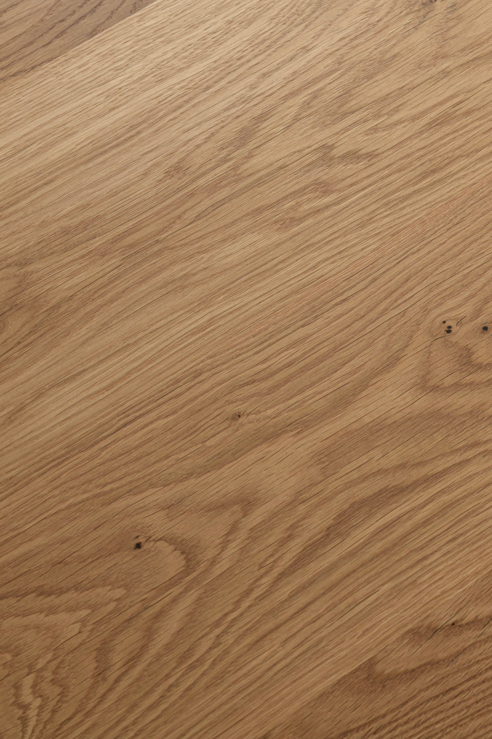 We sand and finish every surface by hand with a natural, low-sheen oil and wax finish. It’s a finish that lets you feel the wood grain and protects the table for daily use.